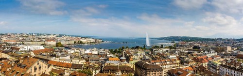 Cityscape with Lake Geneva Lake and the fountain Jet d'eau taken from a tower of the Cathedrale Saint Pierre