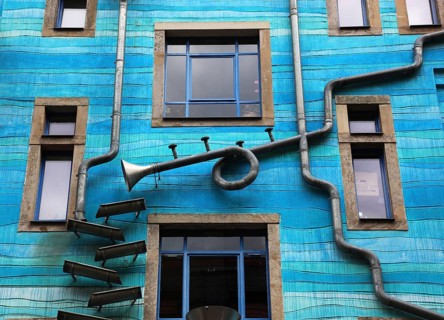 Blue house facade with rain pipes