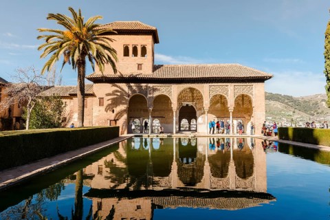Antique Building El Partal with pool and palm trees