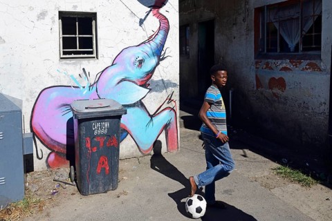 Children play football in Khayelitsha Township