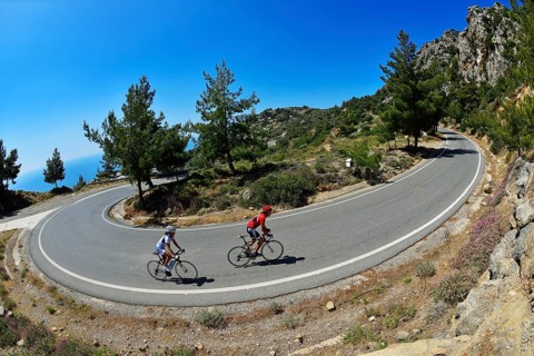 Two racing cyclists on a winding road