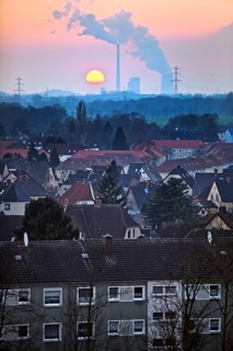 Housing estate with the Gersteinwerk power plant at sunset