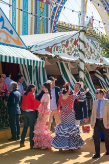 Spanish women with colorful flamenco dresses