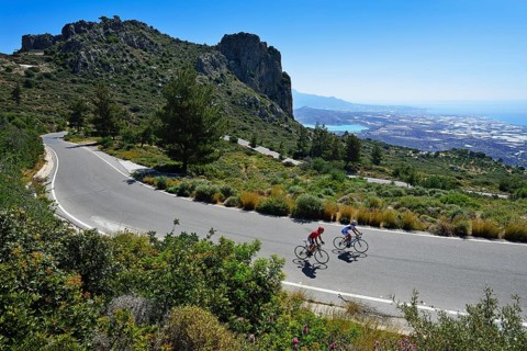 Two racing cyclists on a winding road