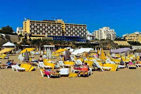 Tourists sunbathing at Rocha Beach