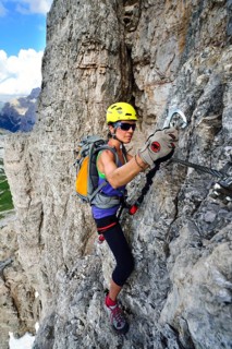 Female climber in the ladder at the Toblinger Knoten