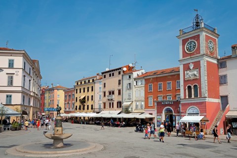 Old town with Venetian clock tower and fountain