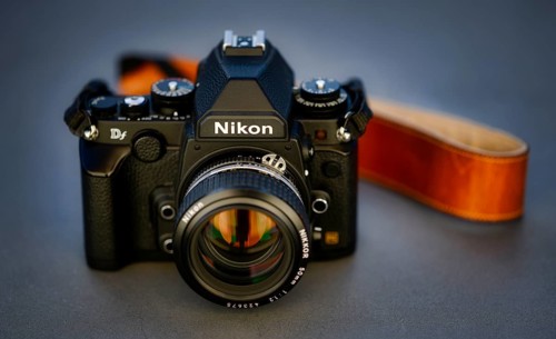 DSLR Nikon Df with Nikkor AI-S 50mm 1.2 in retro style