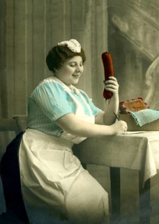 Housekeeper writes a letter with a big sausage in her hand