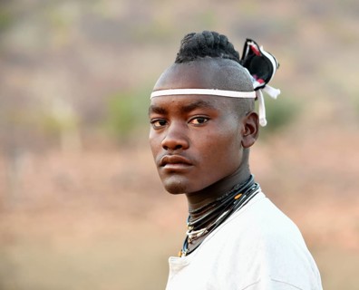 Young Himba man with traditional hairstyle