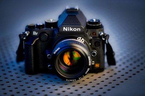 DSLR Nikon Df with Nikkor AI-S 50mm 1.2 in retro style