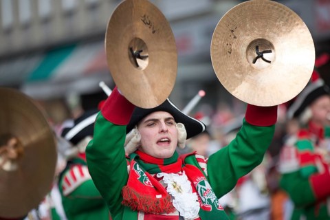 Musician of a brass band with cymbals in uniform