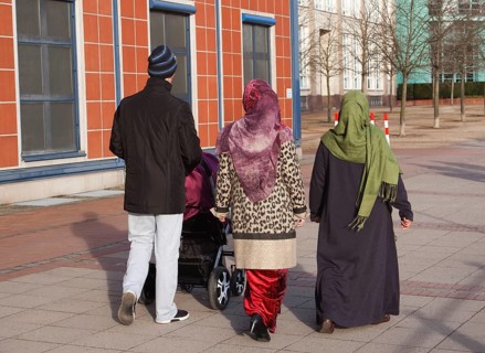 Muslim family with pram