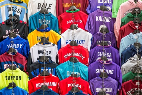 Football jerseys with names of football players for sale at sales stall