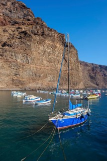 Fishing boats and sailing boat in the port