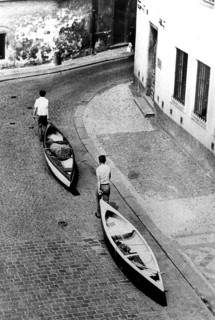 Men transport canoes