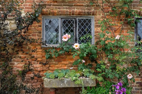 Old brick facade with lattice windows