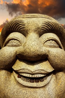 Ebisu Buddha with coins in his mouth