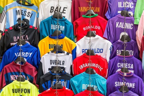 Football jerseys with names of football players for sale at sales stall