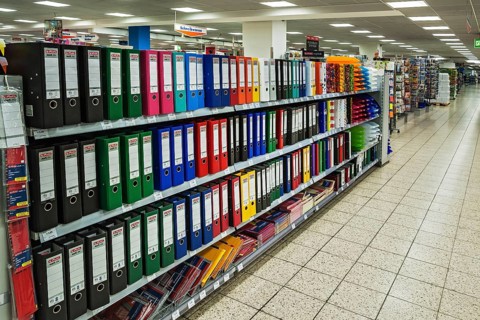 Shelf with office supplies in a supermarket