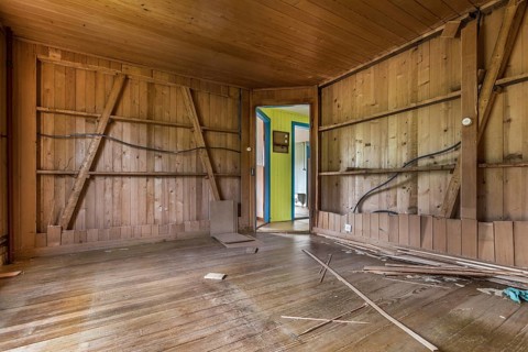 A room paneled with wood in a house that will be demolished