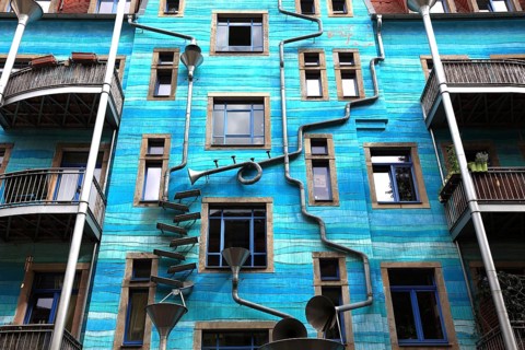 Blue house facade with rain pipes
