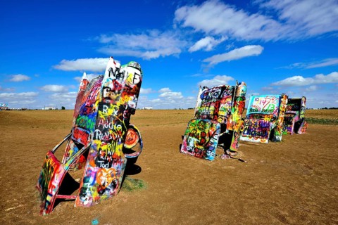 Painted Cadillacs rammed into the ground