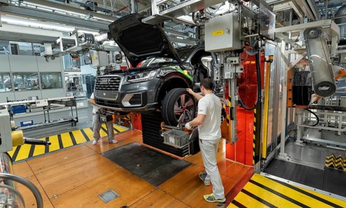 Installation of the wheels on the assembly line for Audi Q2 at the Audi AG plant in Ingolstadt