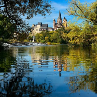 Limburg Cathedral St. Georg or Georgsdom and imburg castle over the river Lahn in autumn