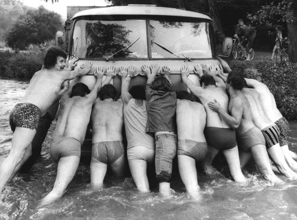 Men push car in water ca. 1970's