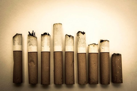 Alignment of nine cigarette butts