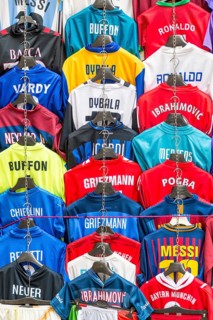 Football jerseys with names of football players for sale at sales stall