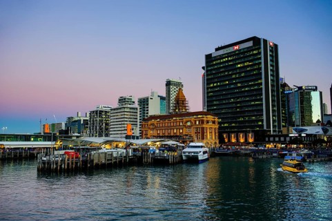 Illuminated waterfront with Ferry Building during dusk