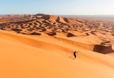 Woman running downhill