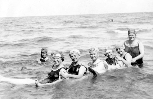 Six women bathing in the sea