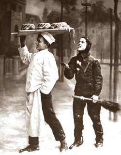 Baker with chimney sweep nibbling cake