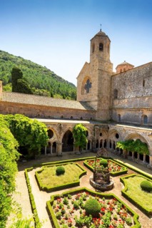 Cloister and well at the Abbaye Sainte-Marie de Fontfroide or Fontfroide Abbey near Narbonne