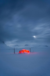 Tent by full moon in the snow