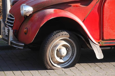 Flat tire on vintage car