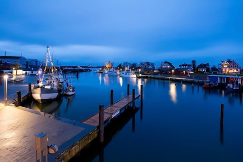 Baltic Sea harbour with boats at dusk