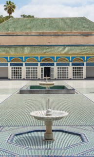 Ornate courtyard with columns and fountain