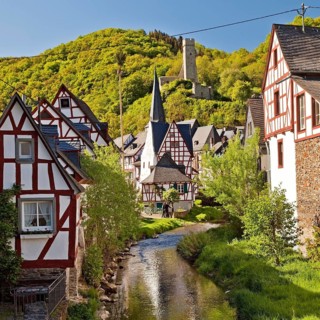 Historic town center with half-timbered houses on Elzbach and the ruins of the Lion Castle