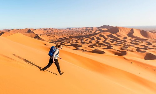 Woman running downhill
