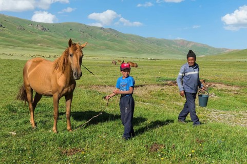 Kyrgyz boy with his horse