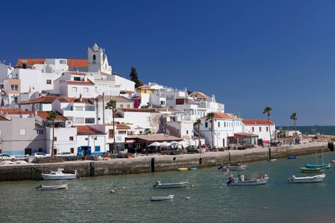 Boats in front of the fishing village of Ferragudo
