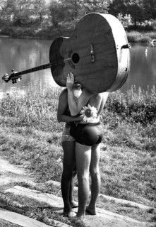 Pair behind big guitar ca. 1970s