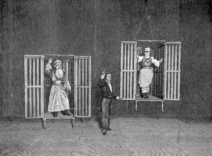 The illusionist Thorn demonstrates the appearance and disappearance of persons in cages