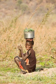Tonga girl with vegetables
