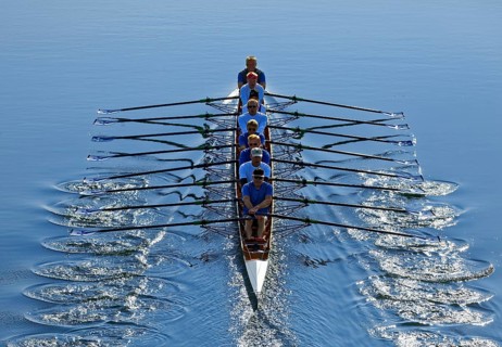 Rowers rowing in rowing boat