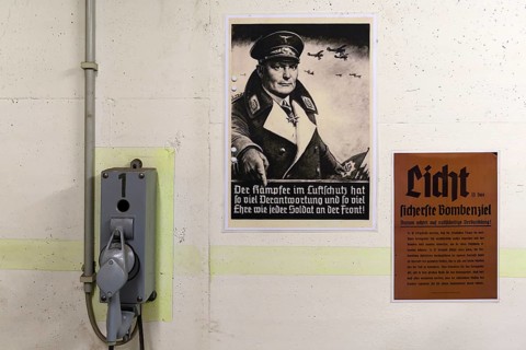 Bunker telephone and poster of Goring from a civil air-raid shelter in World War II